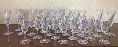a lot of wine glasses sitting on a table