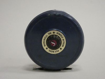 a blue plastic object with a red star on it