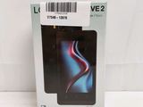 packaging of a black phone in a box with a barcode on it