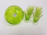 a green glass bowl and six glasses on the table