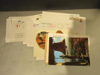 a pile of postcards sitting on top of a table