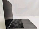an open laptop computer sitting on top of a white table