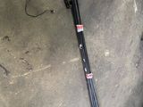 a pair of skis and a pair of ski poles laying on the ground