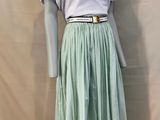 an image of a mannequin wearing a skirt and a t - shirt