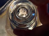 a person holding a glass of water in their hand