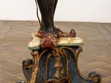 statue of a man on a pedestal with a bird on his shoulder