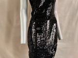 a mannequin dress with a black and silver sequin