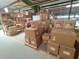 a lot of boxes that are stacked up in a warehouse