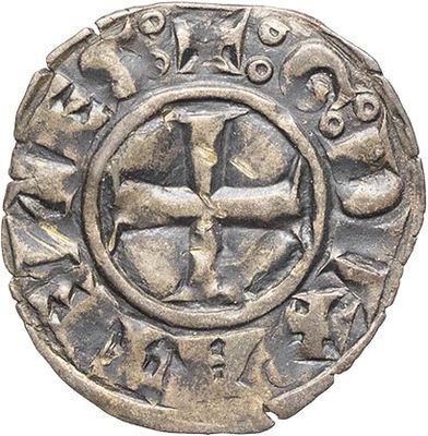 a silver coin with an image of a cross on it