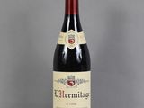 a close up of a bottle of wine on a table
