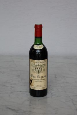 a bottle of wine that is sitting on a table