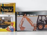 two boxes of construction toys on a white surface