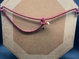 a picture of a box with a rope attached to it