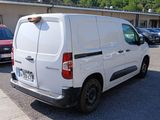 a white van that is parked in a parking lot