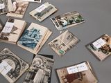 a lot of old postcards that are on the table