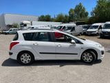 a small white car parked in a parking lot