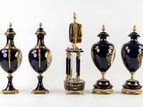 five vases that are sitting on a white surface