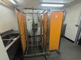 a picture of a kitchen with orange partitions and a sink