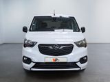the front view of a white van parked in a white room