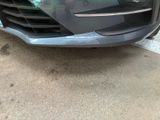 a close up of the front bumper of a car