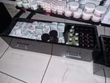 many bottles and containers of cosmetics on the counter