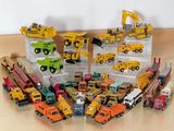 a lot of toy trucks that are sitting on the floor