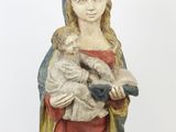 an image of a statue of a woman holding a baby in her arms