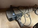 an image of a dirty water pump in a bathroom