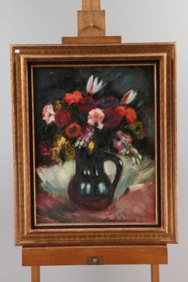a painting of flowers in a vase on a easel