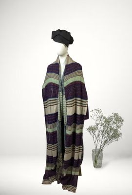 an image of a mannequin dressed in a hat and scarf