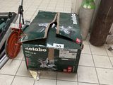 a box that is sitting on the floor next to a scooter