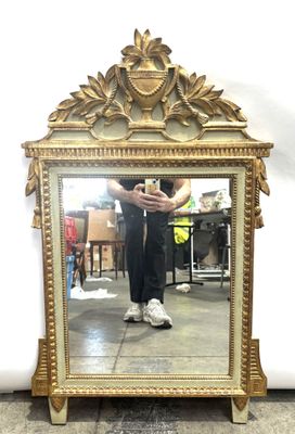 a man taking a picture of himself in a mirror