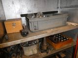 a metal shelf with tools on it in a room