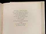 an open book with a poem on it on a table
