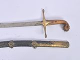 two different types of swords on a white surface