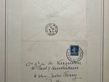 an old envelope with a stamp on it is hanging on a wall