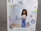 barbie doll in a box with a picture of a girl holding a baby