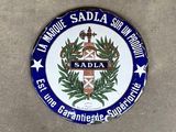 a blue and white plate with a picture of a coat of arms on it