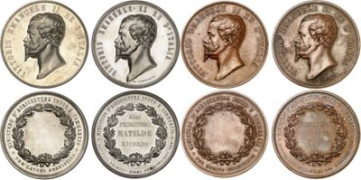 a close up of a bunch of coins with faces on them