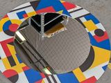a picture of a manhole in the middle of a street