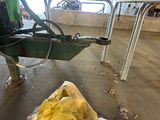 a bag of food sitting on the ground next to a machine