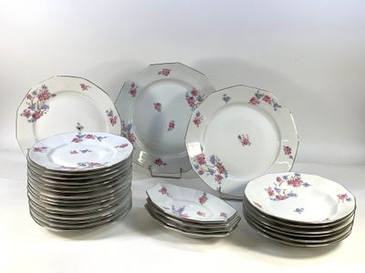a lot of plates that are sitting on a table
