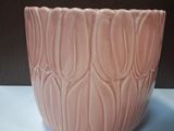 a pink bowl that is sitting on a table