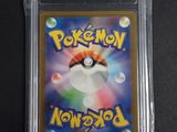 a close up of a pokemon card in a plastic case