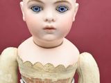 a small doll that is sitting on a table