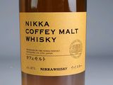 a bottle of nikka coffey malt whisky on a table