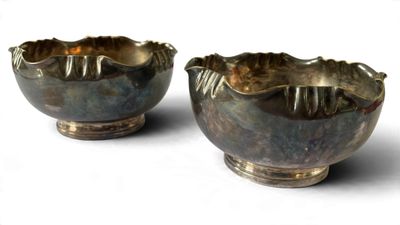 two bowls that are sitting on a white surface