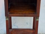 a small wooden table with a shelf on top of it