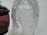 two vases sitting next to each other on a table