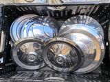 a lot of pots and pans sitting in a crate